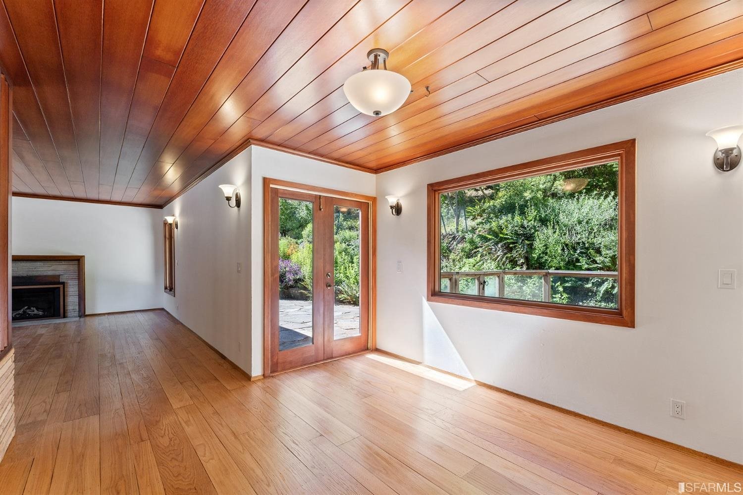 1180 Park Hills Road Berkeley, CA 94708 - Photo 21 of 62 a view of an empty room with wooden floor and a window
