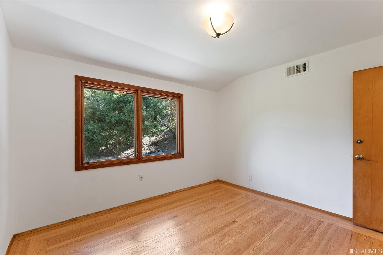 1180 Park Hills Road Berkeley, CA 94708 - Photo 32 of 62 a view of empty room with wooden floor and fan