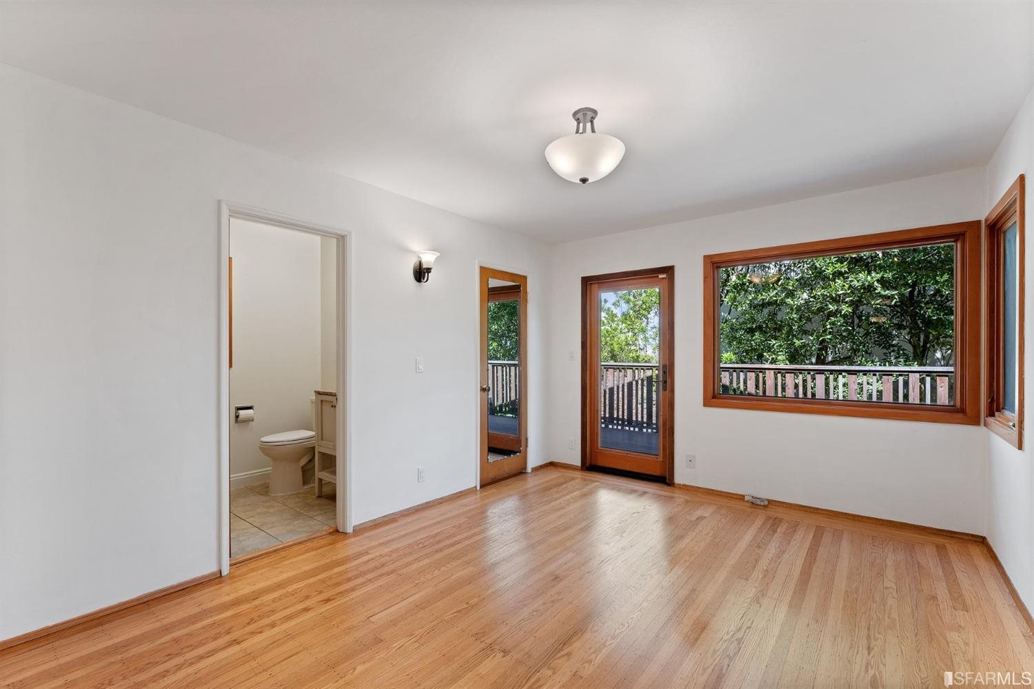 1180 Park Hills Road Berkeley, CA 94708 - Photo 34 of 62 a view of an empty room with a window and wooden floor