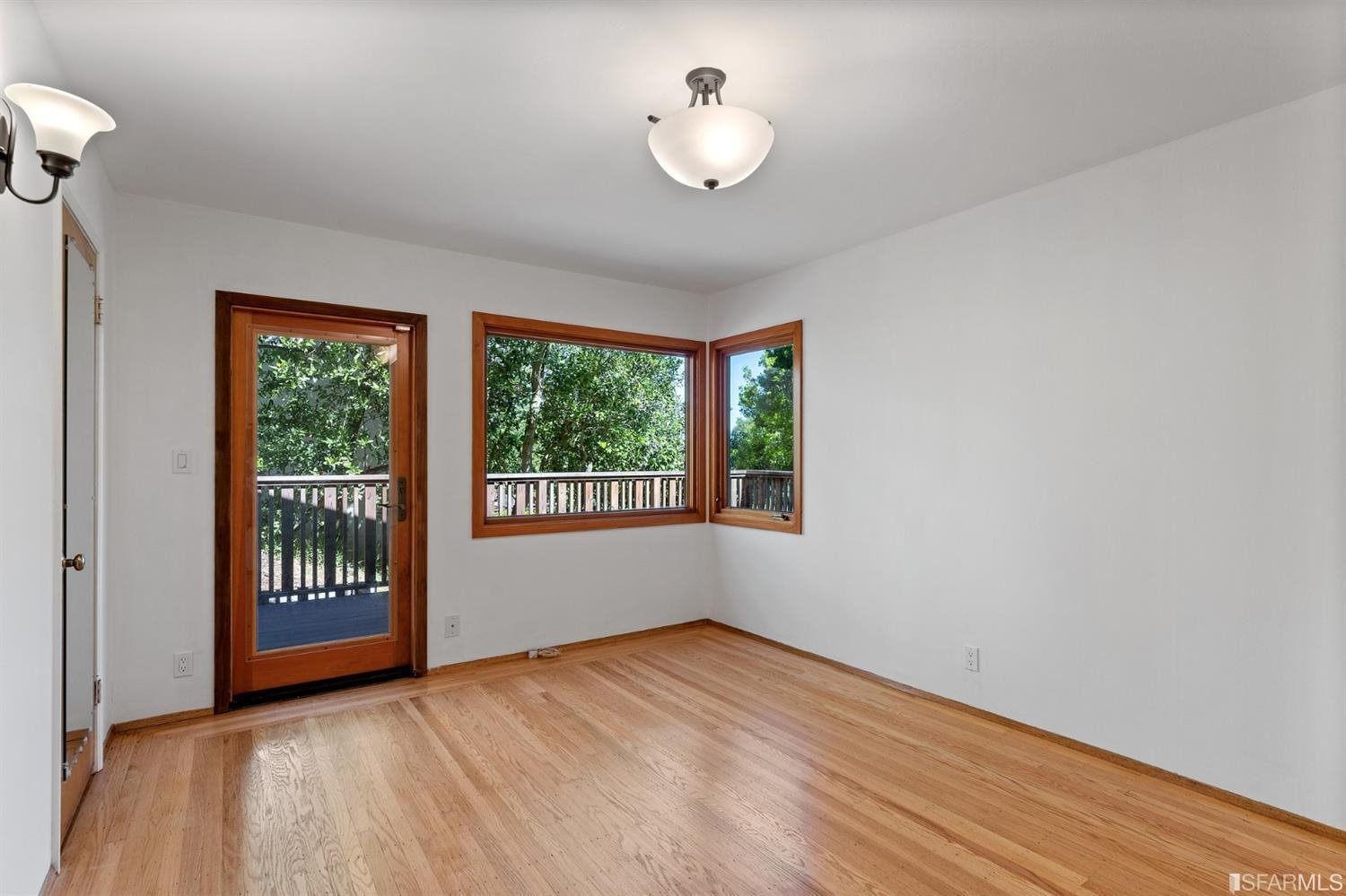 1180 Park Hills Road Berkeley, CA 94708 - Photo 35 of 62 a view of an empty room with wooden floor and a window