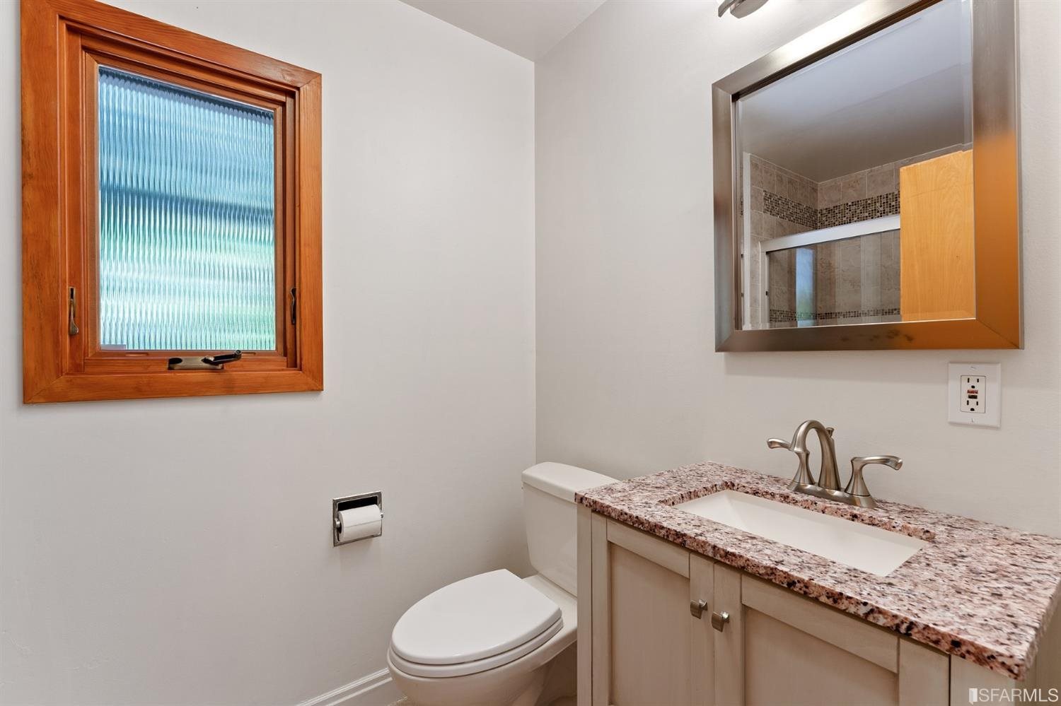 1180 Park Hills Road Berkeley, CA 94708 - Photo 39 of 62 a bathroom with a granite countertop toilet sink and mirror
