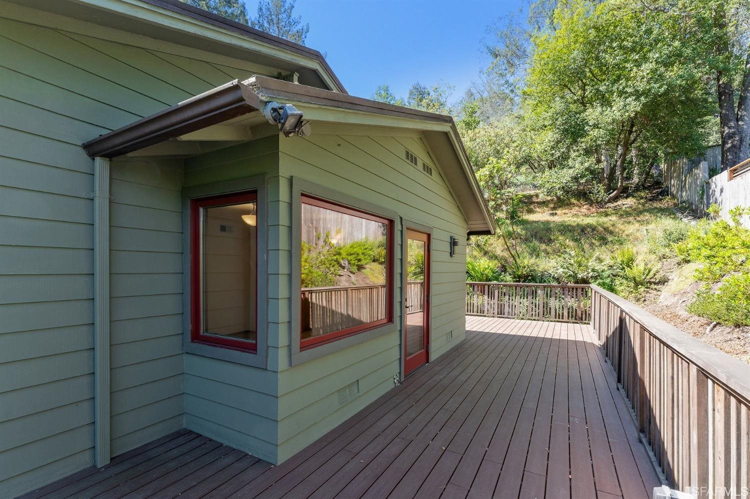 1180 Park Hills Road Berkeley, CA 94708 - Photo 46 of 62 a view of a wooden door and a floor to ceiling window