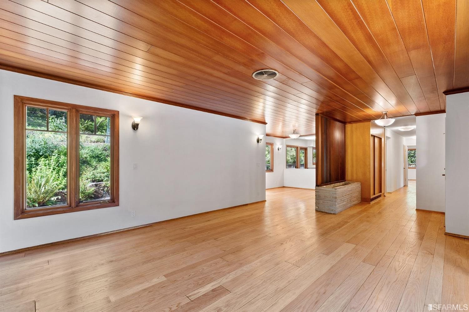 1180 Park Hills Road Berkeley, CA 94708 - Photo 10 of 62 a view of an empty room with window and wooden floor