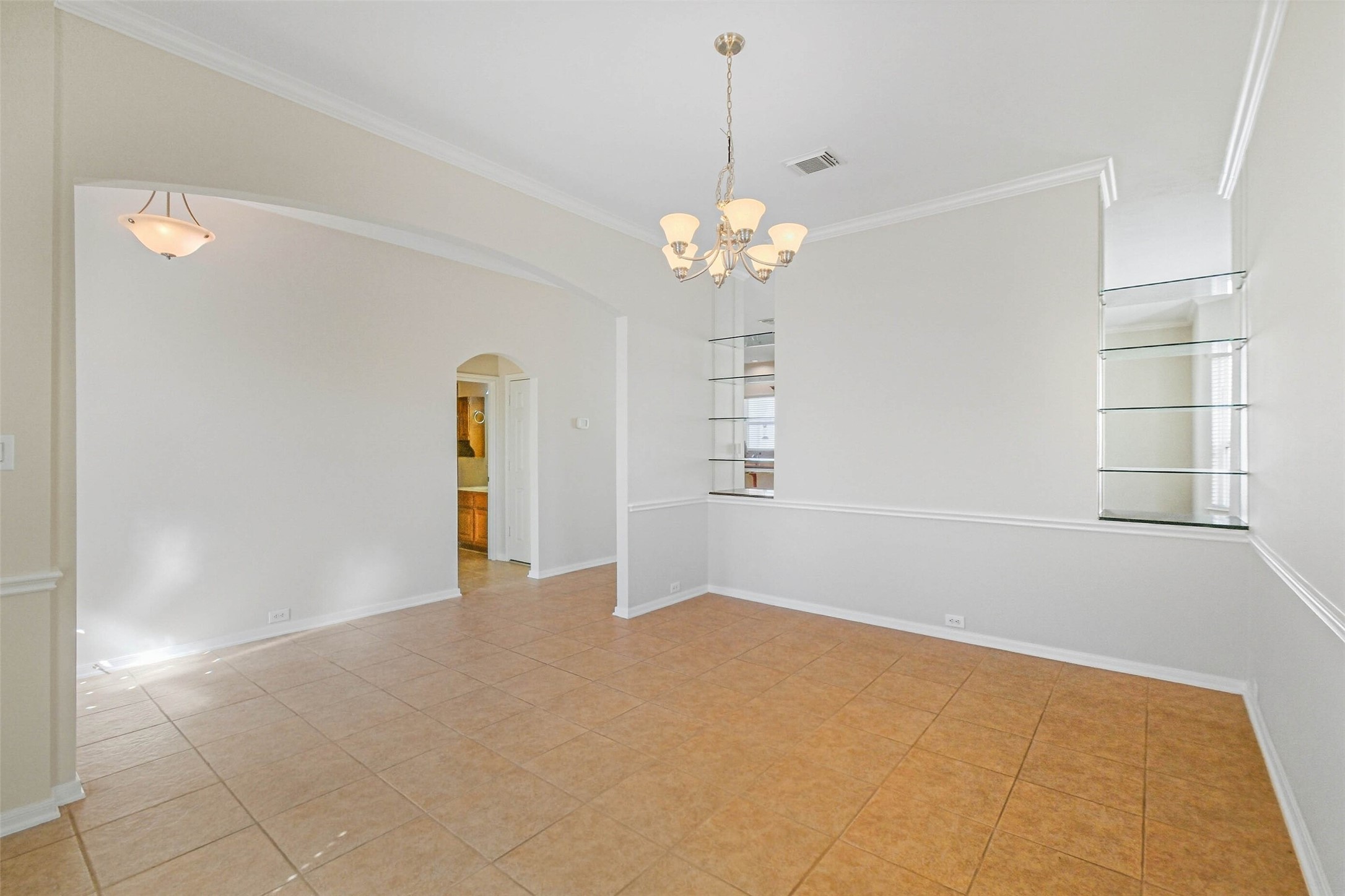 643 East 10th Street Houston, TX 77008 - Photo 6 of 28 a view of a big room with windows and chandelier