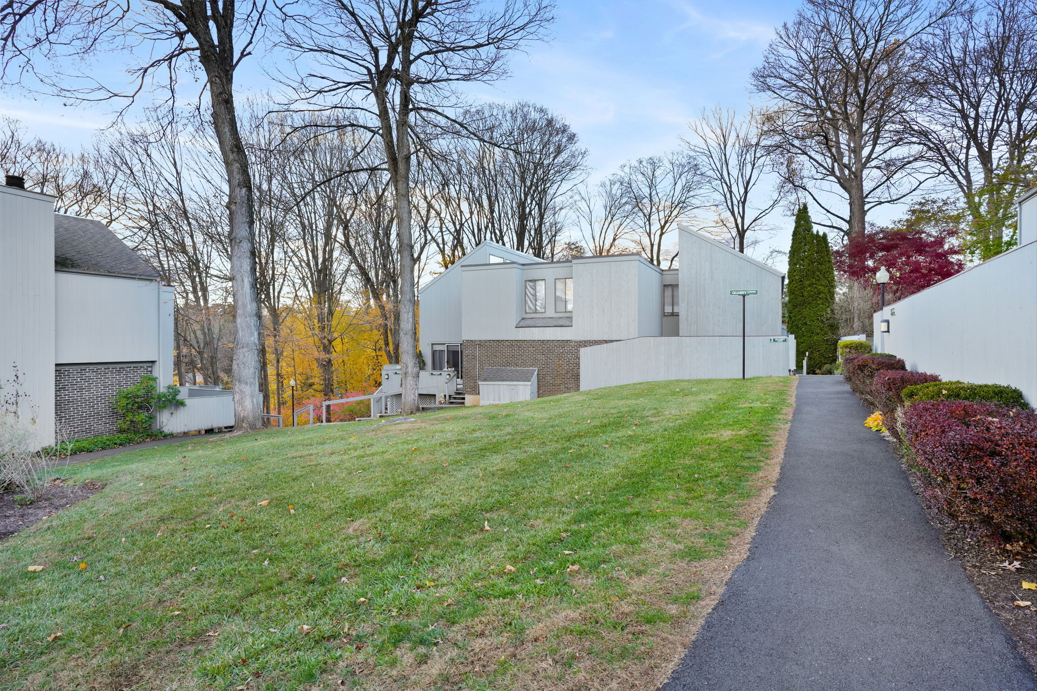 8 Quarry Corner, Unit 8 Ridgefield, CT 06877 - Photo 1 of 28 a front view of a house with garden