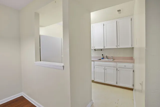a view of cabinets and wooden floor