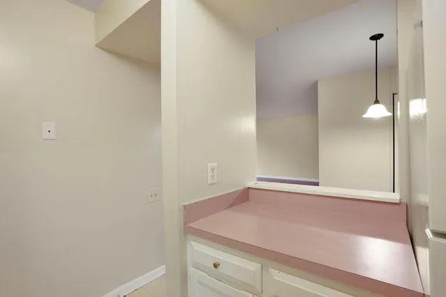 a view of a hallway with closet