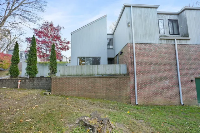 a view of front door and small yard