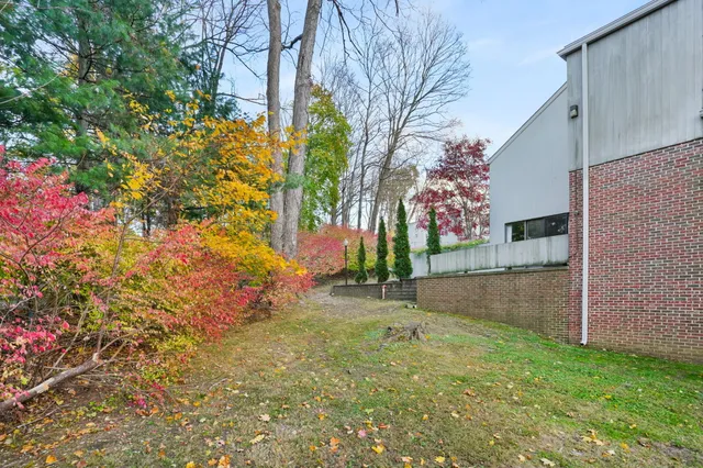 a backyard of a house with lots of green space