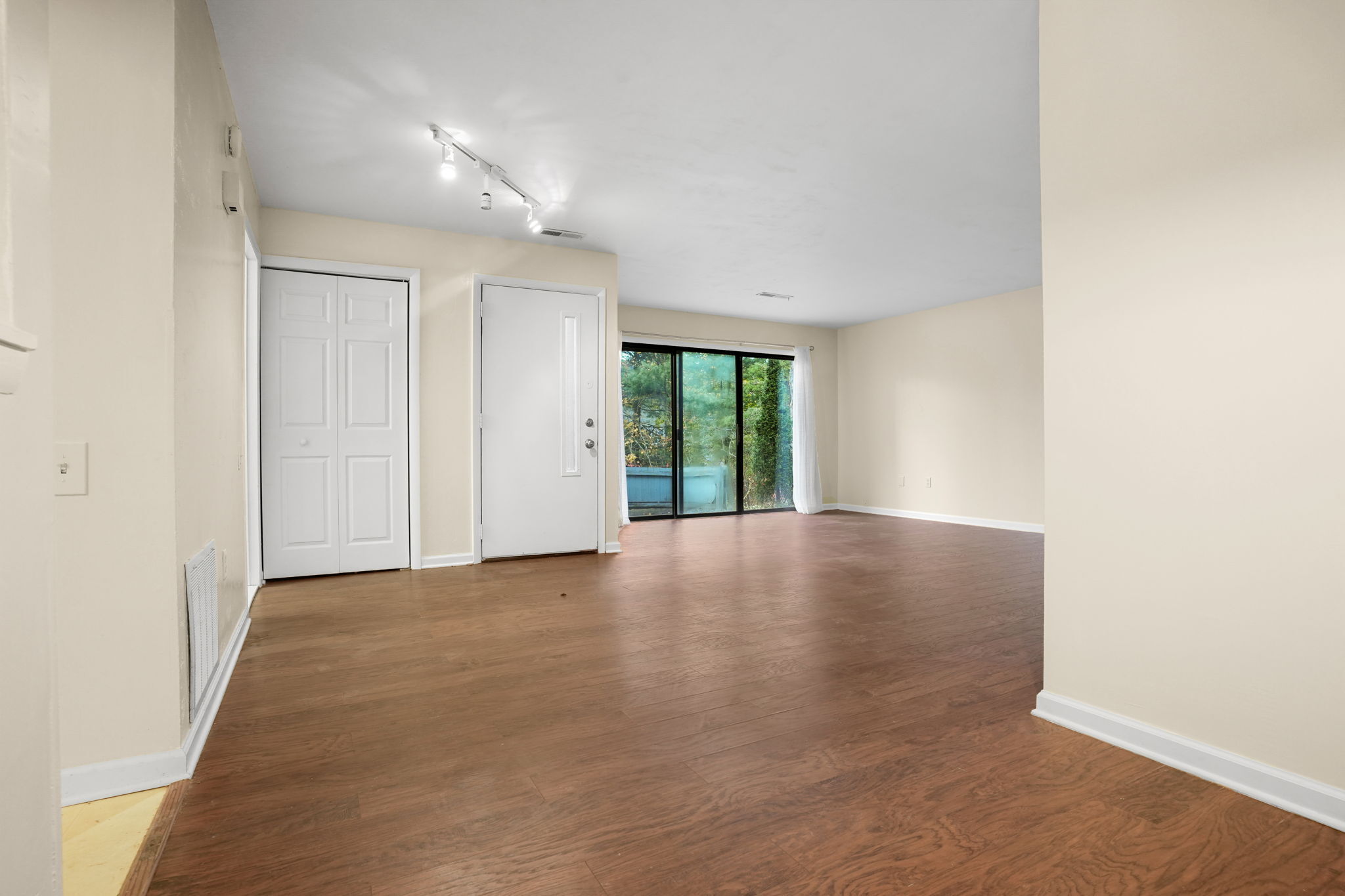 8 Quarry Corner, Unit 8 Ridgefield, CT 06877 - Photo 7 of 28 an empty room with windows and entrance