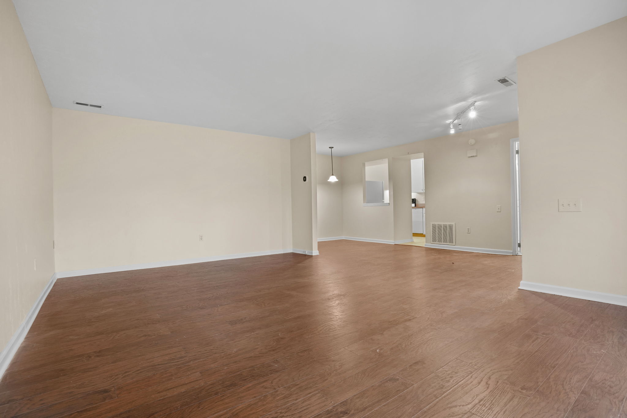 8 Quarry Corner, Unit 8 Ridgefield, CT 06877 - Photo 9 of 28 a view of an empty room with wooden floor and a window