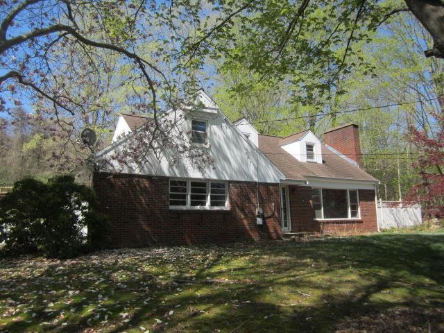 a view of a house with a garden