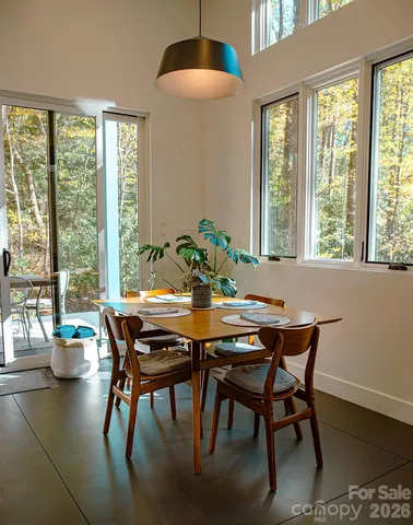 a view of a dining room with furniture and window
