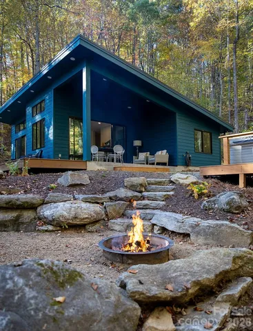 a front view of a house with sitting area