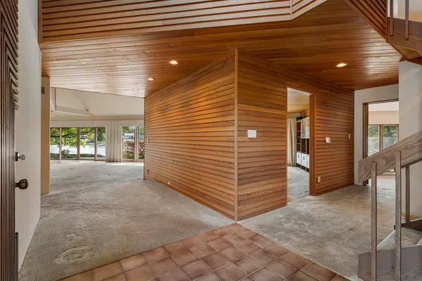 a view of a house with a door and wooden floor