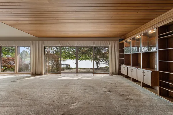 a view of an empty room with a balcony