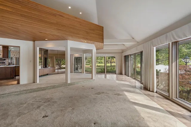 a view of an empty room with a balcony