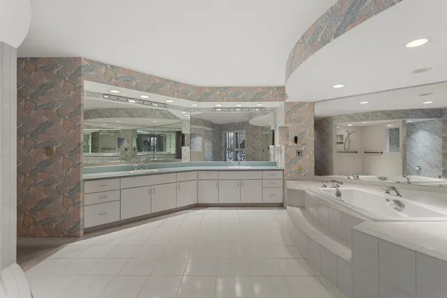a bathroom with a glass shower door