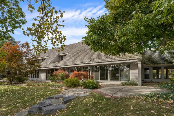 front view of a house with a tree