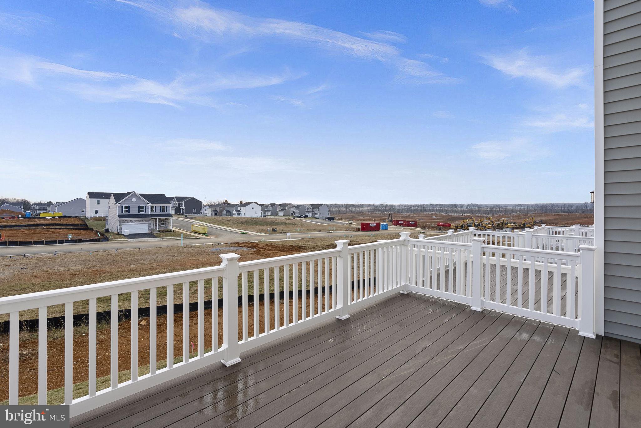 a view of a balcony with wooden floor