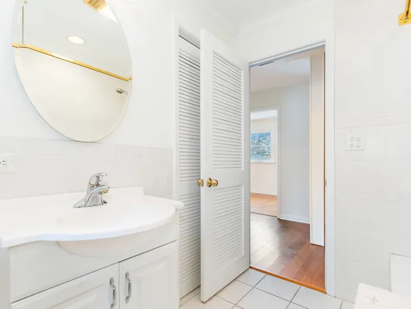 a bathroom with a sink a mirror and a shower