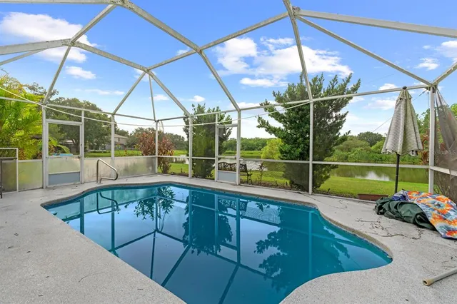 a view of a living room and floor to ceiling window