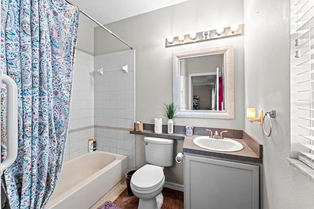 a bathroom with a toilet a sink and a bathtub