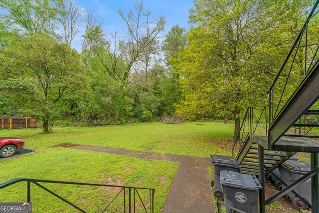 a view of a yard with an outdoor seating
