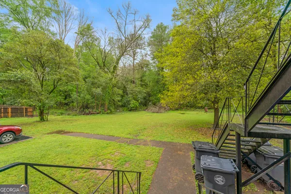 a view of a yard with an outdoor seating
