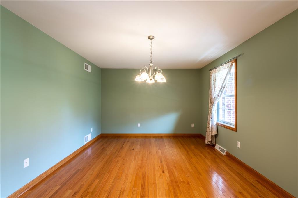 156 Chickadee Road Kittanning, PA 16201 - Photo 16 of 25 a view of empty room with wooden floor and fan