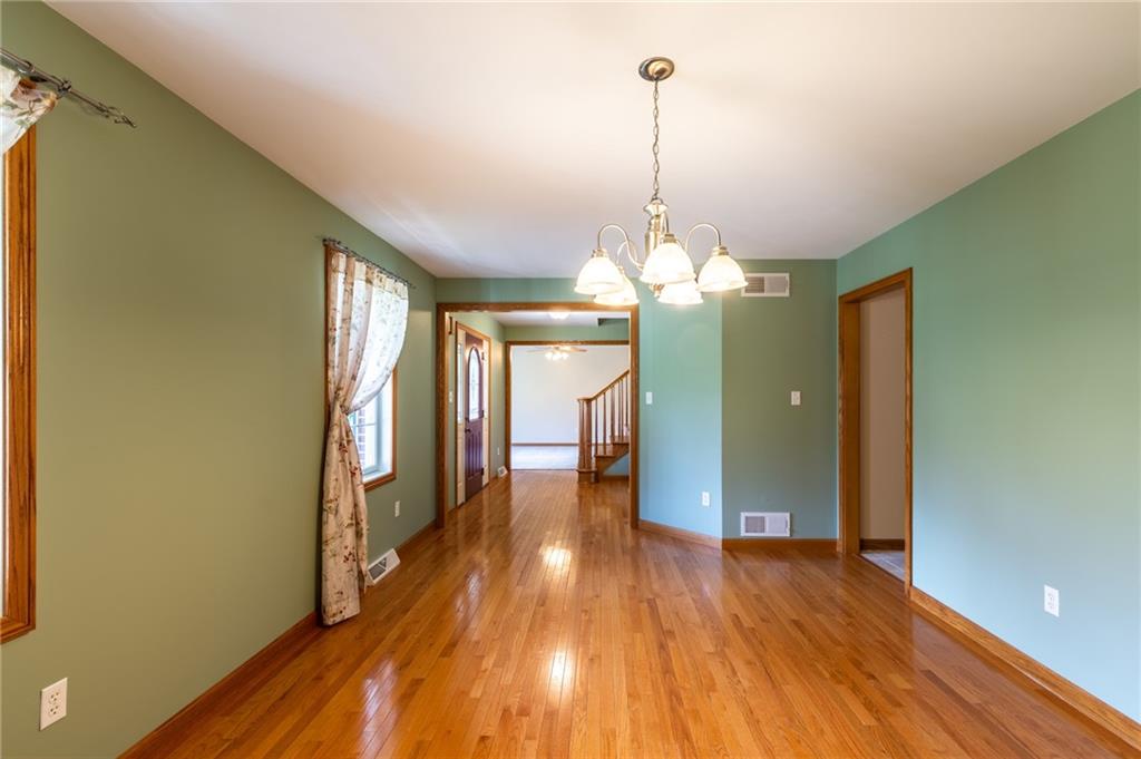 156 Chickadee Road Kittanning, PA 16201 - Photo 17 of 25 a view of a room with wooden floor chandelier and entryway