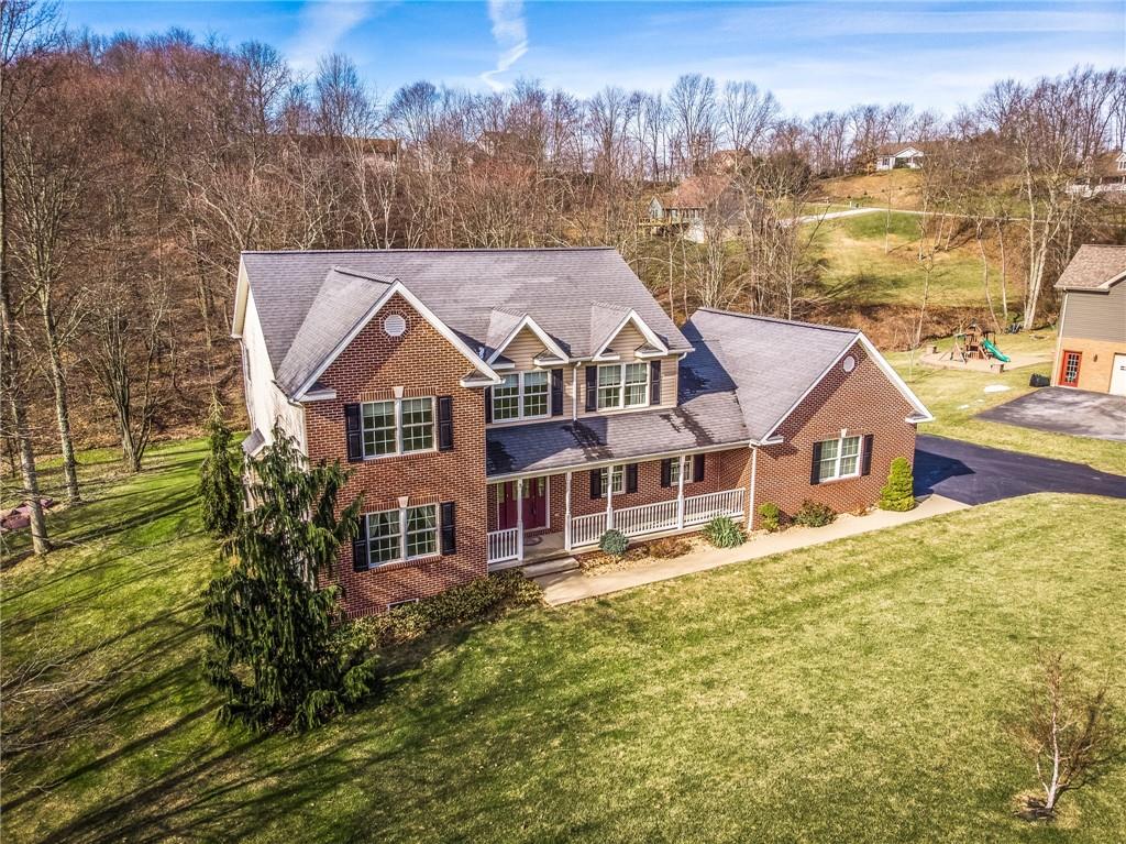 156 Chickadee Road Kittanning, PA 16201 - Photo 3 of 25 a aerial view of a house next to a yard with lake view