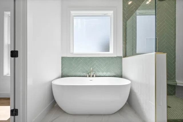 a white bath tub sitting in a bathroom
