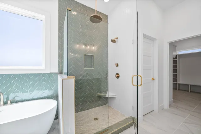 a bathroom with a shower and a bathtub