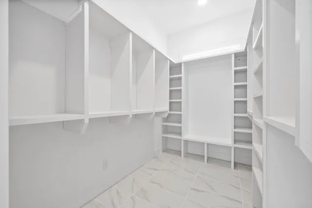 a view of an empty walk in closet
