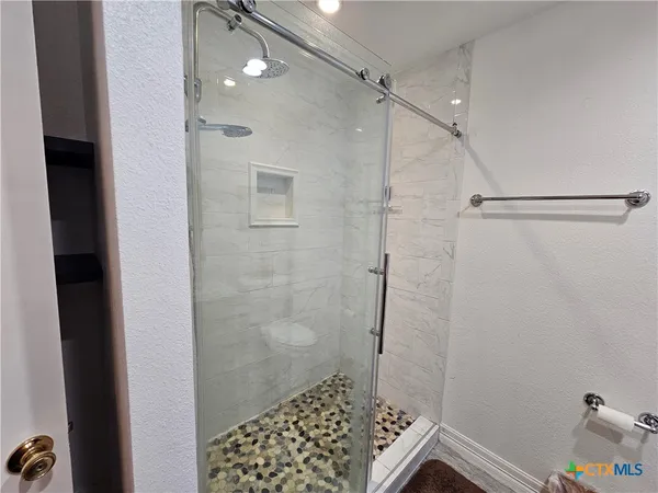 a view of staircase with white walls