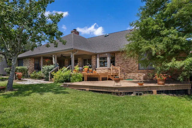 a view of a house with a yard porch and sitting area