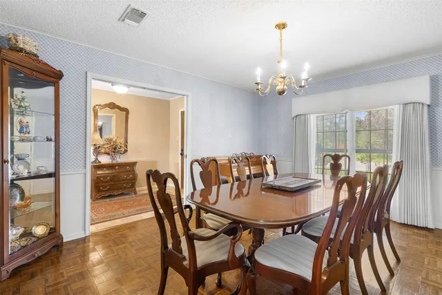 a view of a dining room with furniture window and outside view