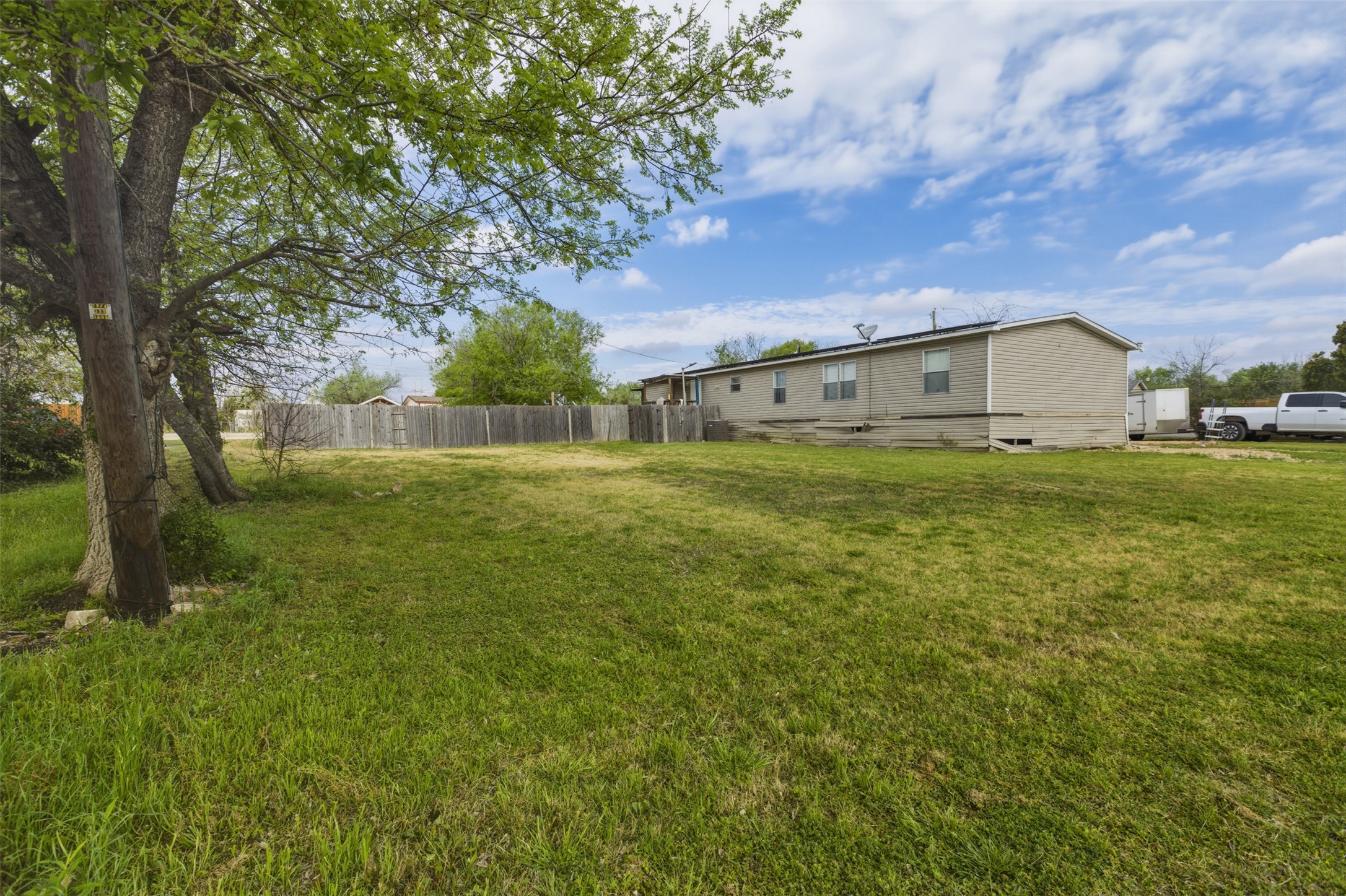 104 Royal Street Taylor, TX 76574 - Photo 17 of 21 a view of big yard with a house