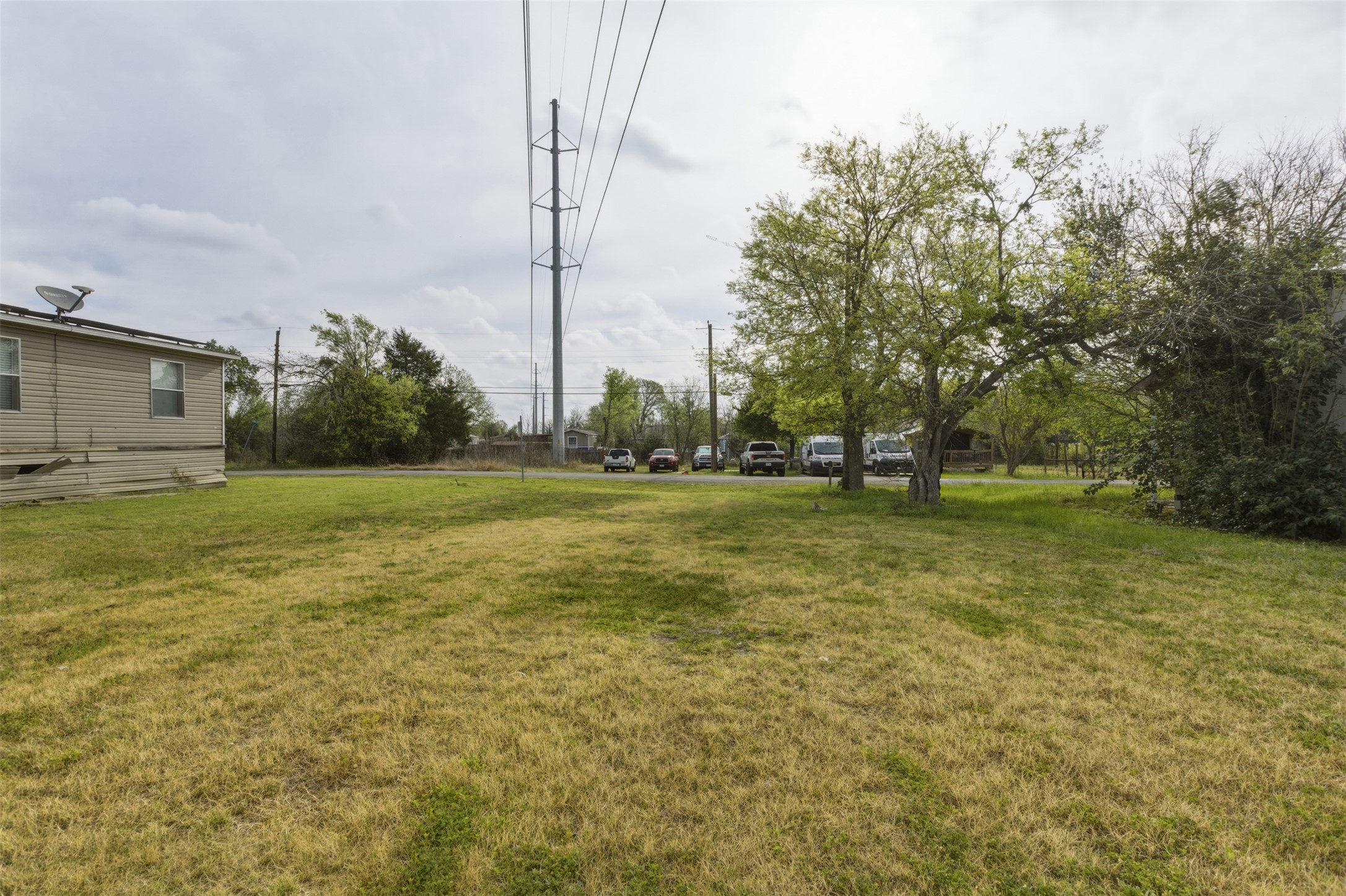 104 Royal Street Taylor, TX 76574 - Photo 19 of 21 a view of a field with an trees