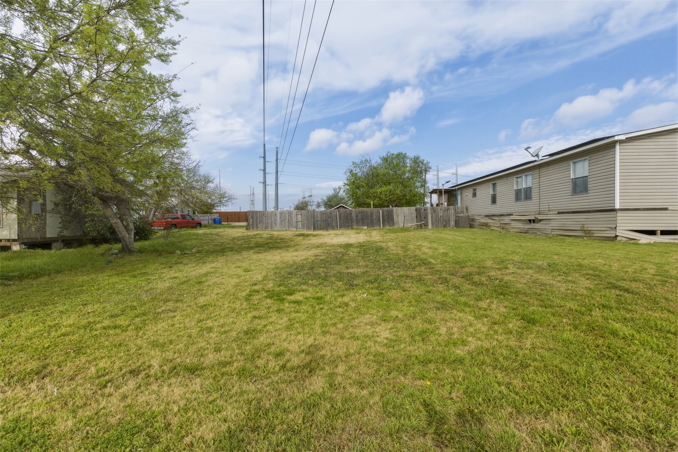 104 Royal Street Taylor, TX 76574 - Photo 21 of 21 a backyard of a house with lots of green space