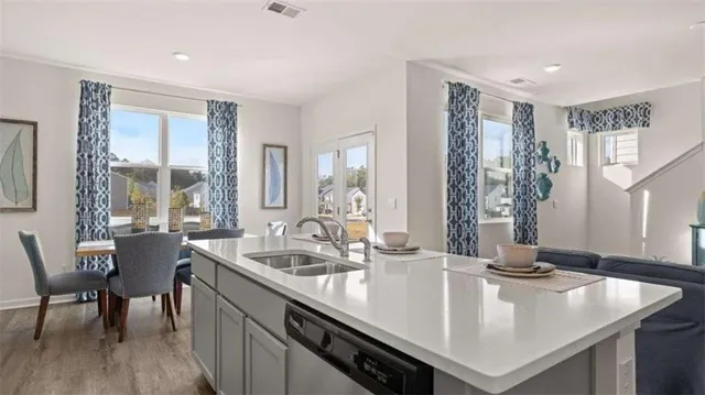 a view of kitchen island a sink and living room