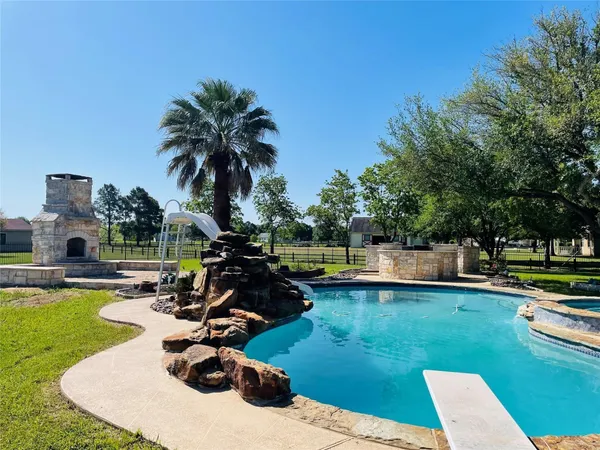 a view of a swimming pool and lounge chair