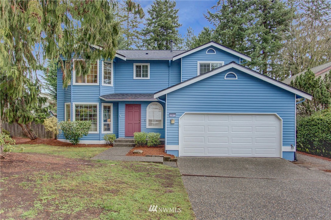 23613 Meridian Place West Bothell, WA 98021 - Photo 1 of 32 a front view of a house with a yard and garage