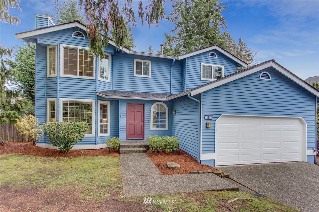 23613 Meridian Place West Bothell, WA 98021 - Photo 2 of 32 a front view of a house with garden