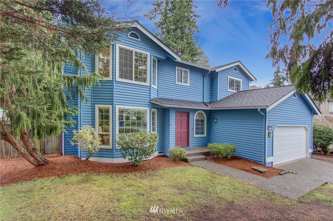 23613 Meridian Place West Bothell, WA 98021 - Photo 3 of 32 a front view of a house with garden