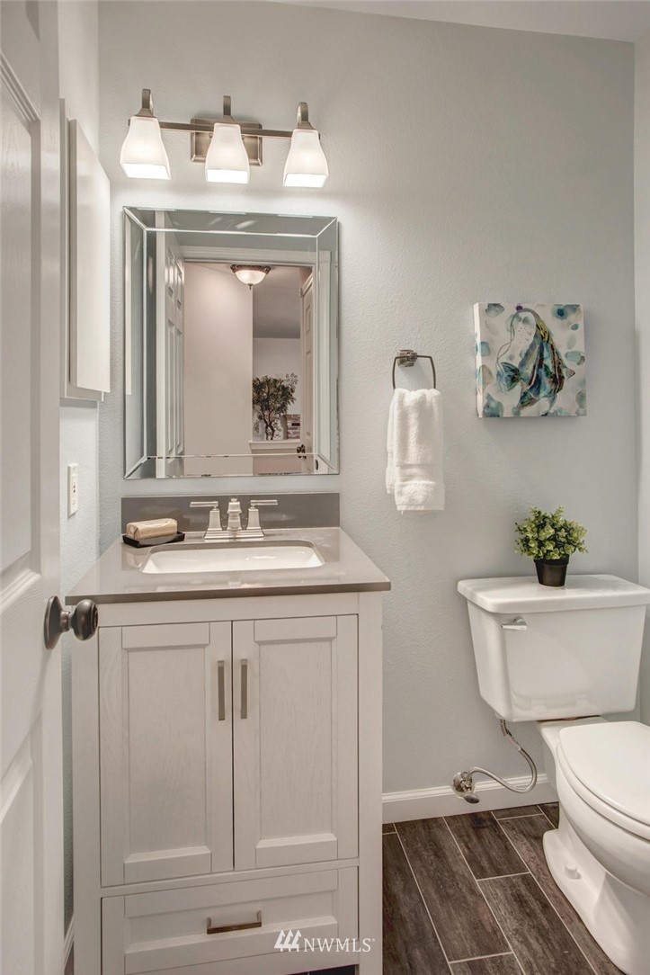23613 Meridian Place West Bothell, WA 98021 - Photo 21 of 32 a bathroom with a toilet a sink and mirror