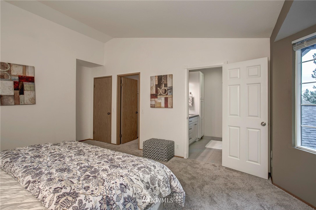 23613 Meridian Place West Bothell, WA 98021 - Photo 24 of 32 a bedroom with a bed and a window