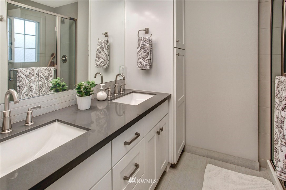 23613 Meridian Place West Bothell, WA 98021 - Photo 25 of 32 a hallway with sink and mirror