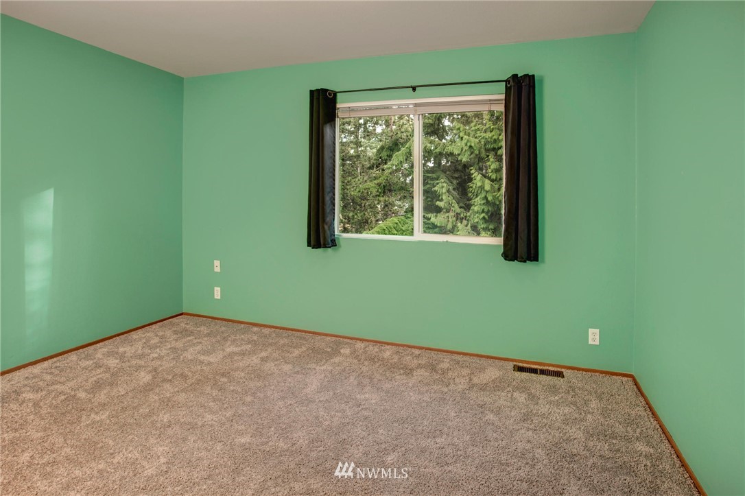 23613 Meridian Place West Bothell, WA 98021 - Photo 30 of 32 a view of a room that has a window and a ceiling fan